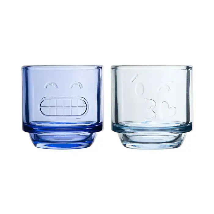 Bougeoir en verre bleu 2ass transp 7.5cm